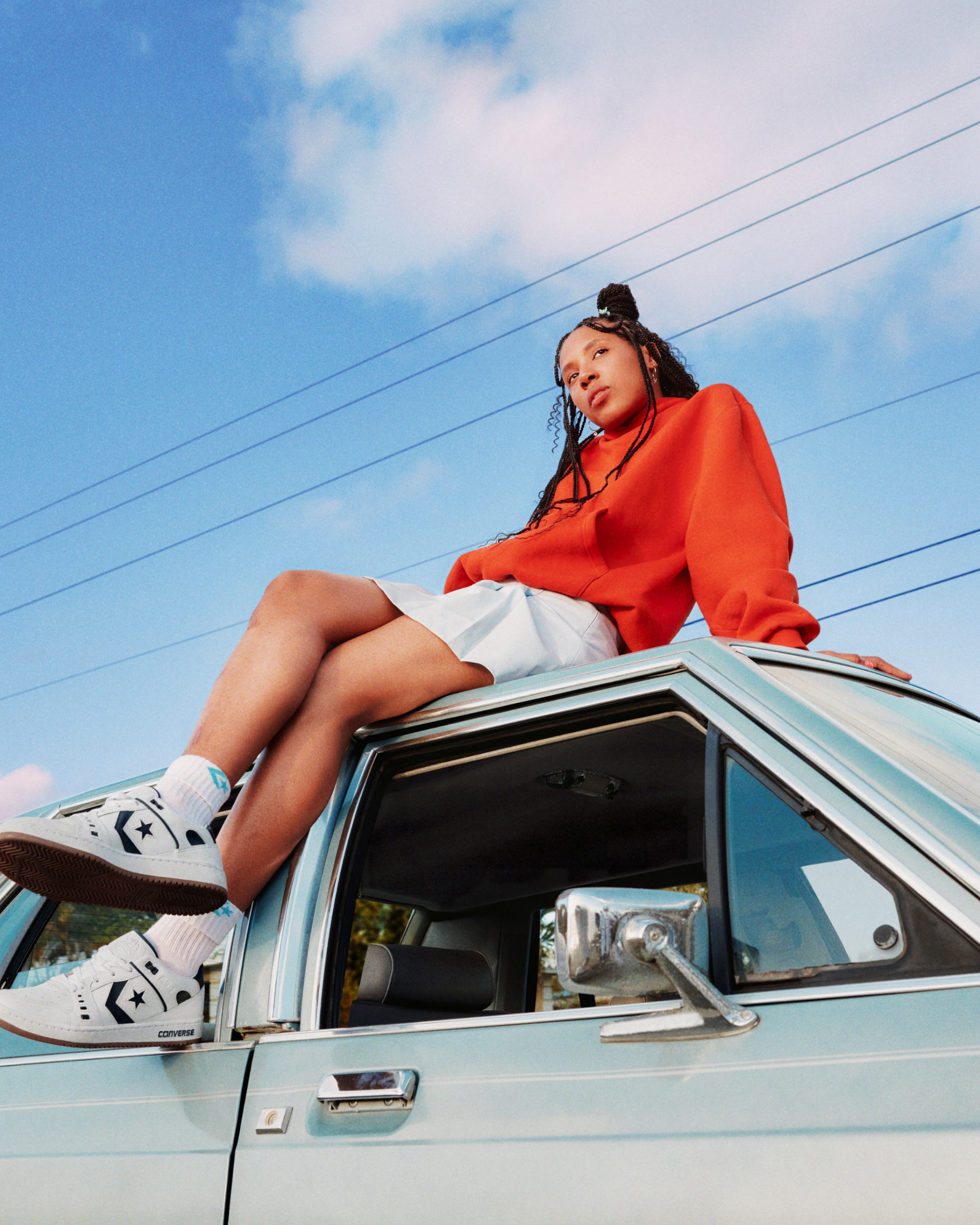 Girl on top of car wearing Converse AS-1 Pro photographed by Yavez Anthonio for WØRKS